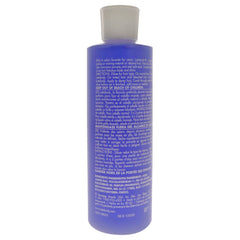 Lotta Body setting lotion applied to hair for added body and hold.