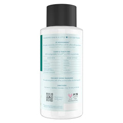 Closeup of coconut milk conditioner label highlighting nourishment and moisture.