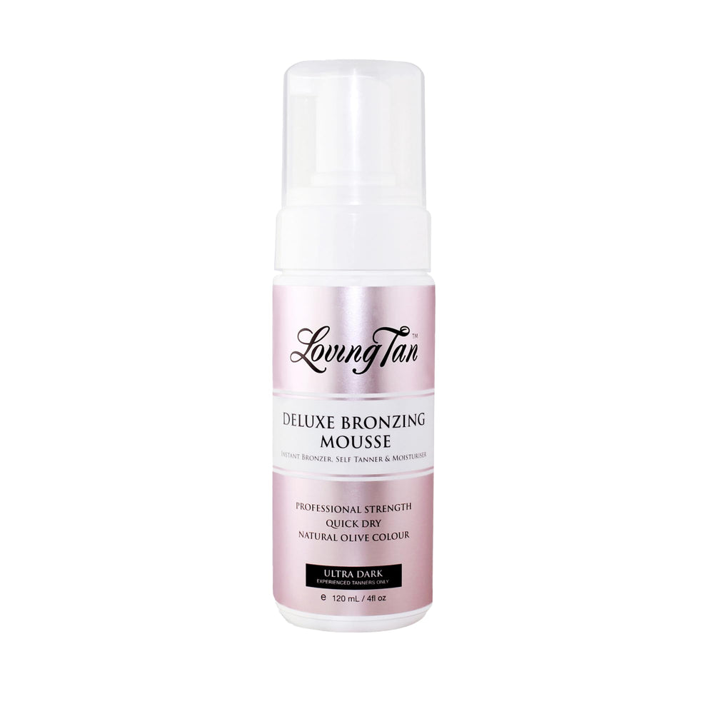 Loving Tan Deluxe Mousse applied with mitt for streak-free coverage.