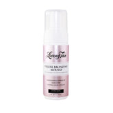 Loving Tan Deluxe Mousse applied with mitt for streak-free coverage.