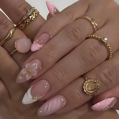 LPOODDNU embossed flower and gold bead designs on pink nails for elegance.