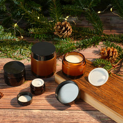 Lustervial amber jar with mini spoon for precise product dispensing.