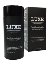 LUXE Hair Building Fibers jar cap shows secure lid for travel-friendly use.