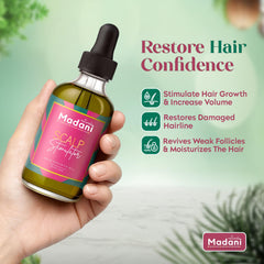 Hands massaging Madani Naturals oil into scalp for hydration