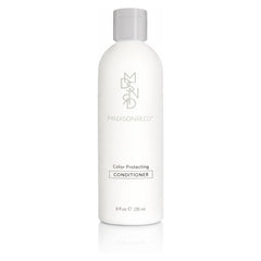 Madison Reed Color Protecting Conditioner bottle demonstrates color retention and shine