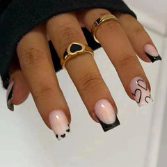 Maigitur uñas negro con corazón blanco, acabado brillante para evento.