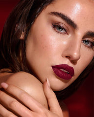 Maki Yika Burgundy lipstick on lips displaying bold matte burgundy shade