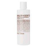 MALIN+GOETZ Hydrating Basil Shampoo bottle shows a daily cleanse that nourishes dry hair.