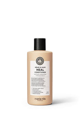 Maria Nila Head and Hair Heal conditioner bottle ready for use, offering scalp soothing benefits.