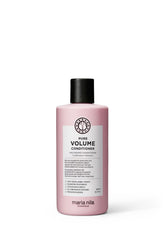 Maria Nila Pure Volume Conditioner bottle close-up highlighting the volume-boosting formula.