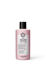 Maria Nila Pure Volume Conditioner bottle close-up highlighting the volume-boosting formula.