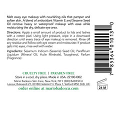 Mario Badescu Carnation Eye Makeup Remover Oil poured onto a cotton pad for cleansing.