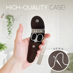MarQus Solingen curved cuticle scissors in hand for nails and grooming.