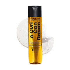 Matrix A Curl Can Dream Shampoo: botella elegante para un lavado suave y definidor.