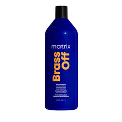 Matrix Brass Off Blue Shampoo bottle pouring, helps neutralize brassy tones for dark blonde and brunette hair