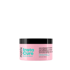 MATRIX Instacure balm bottle close-up showing bond-building formula for damaged hair.