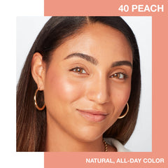 Close-up of Maybelline Fit Me Blush Peach powder for a light, blendable finish.