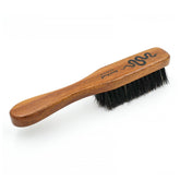 Menesia small beard brush with handle for precise on-the-go grooming.