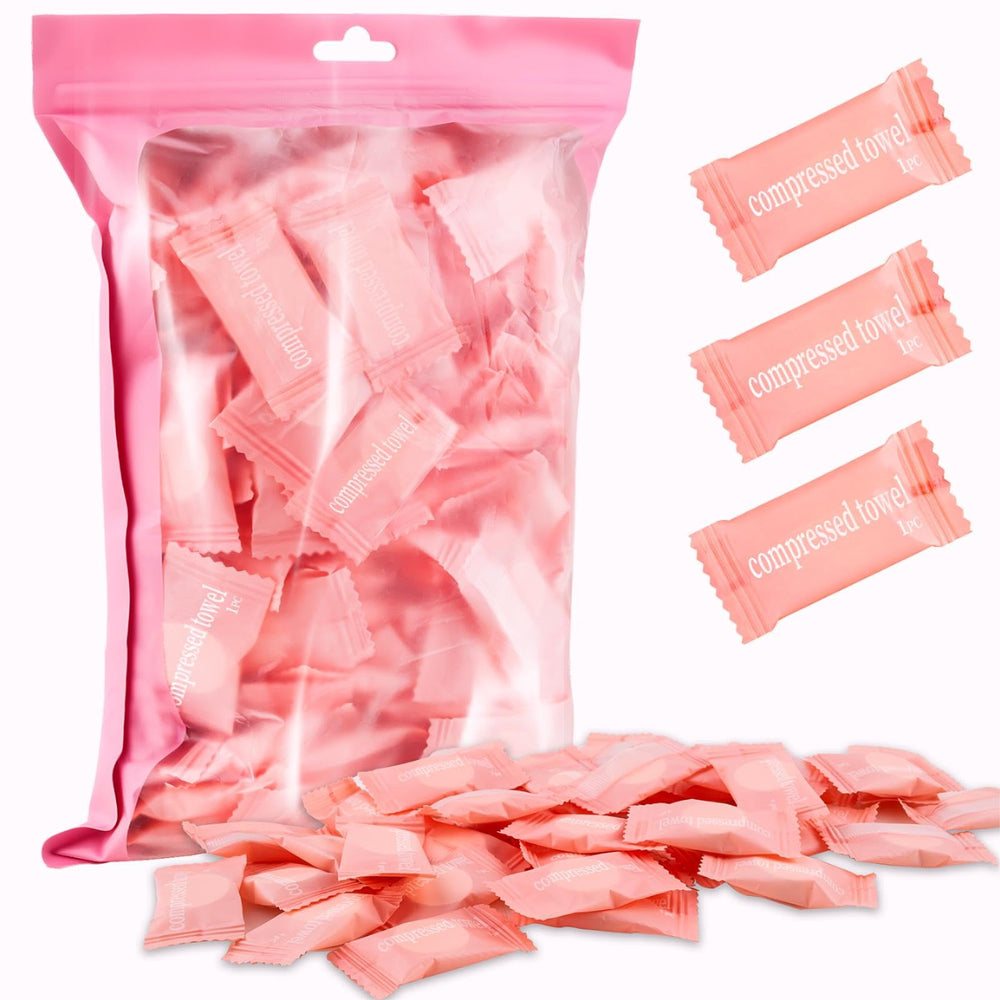 MEQHUO 150-pack compressed towel tablets in pink bag for easy travel prep.