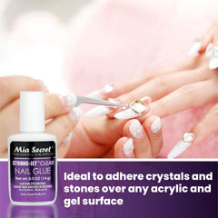 Mia Secret Strong-Jet applying crystals on nail surface for secure hold.