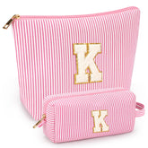 Mibasies two-pack initial makeup bags pink-k front view for stylish organization