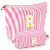 Mibasies two-pcs initial makeup bags in pink, ideal for travel storage.