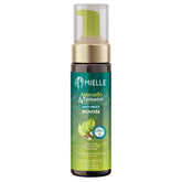 Botella de Mielle Avocado & Tamanu Mousse para definición suave de rizos.