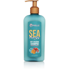 Champú Mielle Organics con musgo marino en botella, hidratación suave para cabello seco.