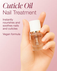 Close view of Mineral Fusion oil drops applying to a nail.