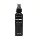 Minute Hair Fiber Lock Spray bottle showing secure hold for natural-looking fibers.