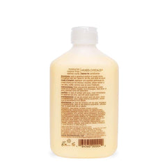 Mixed Chicks leave-in cream application highlights frizz control and lightweight slip.