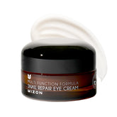 Crema de ojos MIZON Snail Line en envase, cuidado suave para la zona ocular.
