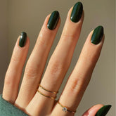 Modelones dark green almond press-on nails kit for quick at-home manicure.