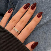 Modelones dark red almond press-on nails in kit for quick salon-like results.