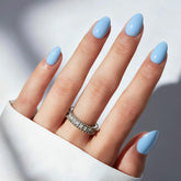 Modelones uñas postizas azules ovaladas para un acabado elegante y rápido.