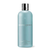Molton Brown Coastal Cypress & Sea Fennel shampoo bottle front with refreshing aroma