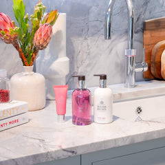 Molton Brown Fiery Pink Pepper pump dispenser highlights a woody aroma