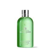 Molton Brown Infusing Eucalyptus Body Wash bottle on shelf for a refreshing start to the day