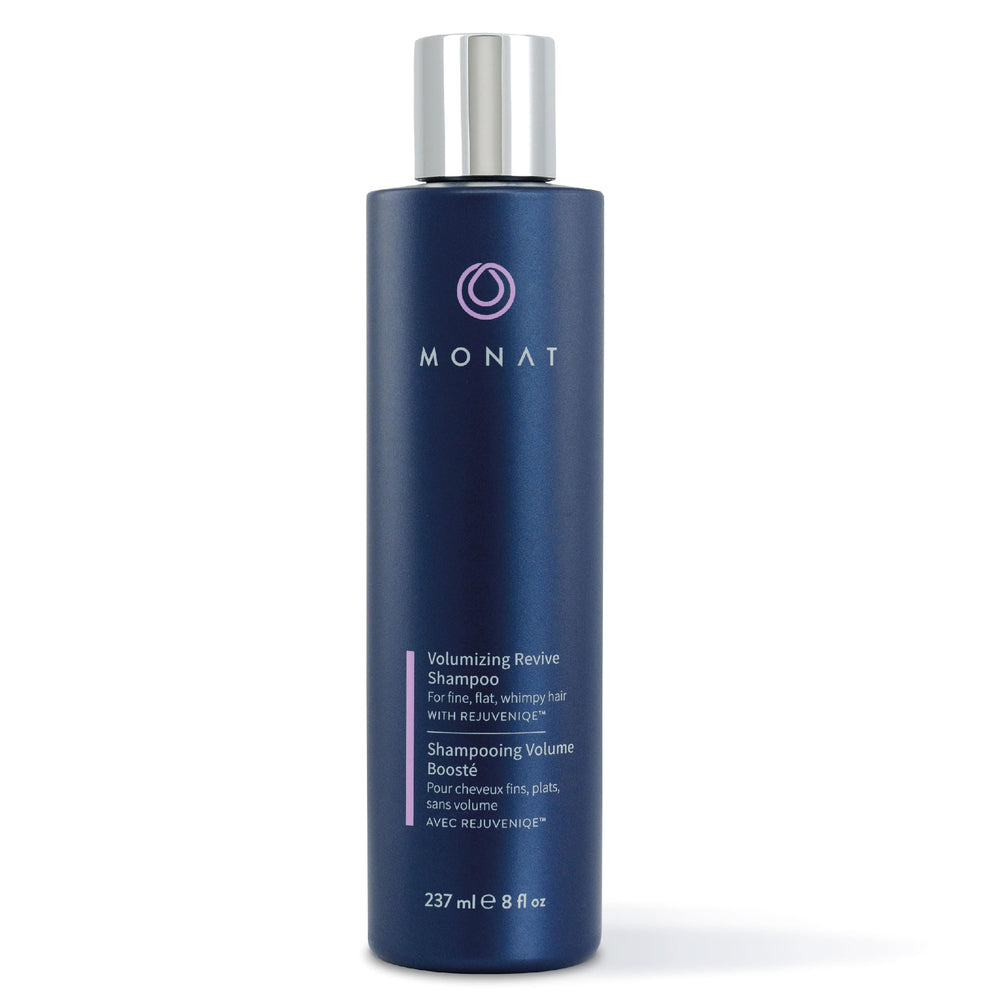 MONAT Volumizing Revive Shampoo bottle close-up showing weightless volume for fine hair.