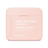 MONDAY Haircare Curl Restore with bamboo extract nourishes curls for hydration and shine.