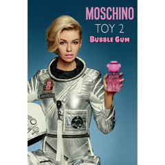 Moschino Bubble Gum spray nozzle in action, suggesting easy application and even scent distribution.