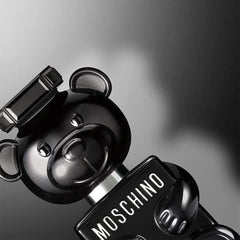 Moschino Toy Boy bear emblem on the label signals iconic branding.