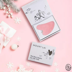 Mount Lai Rose Quartz Gua Sha on cheeks with outward massage supporting gentle lymphatic drainage
