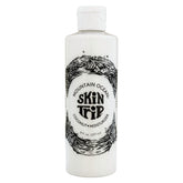 Mountain Ocean Skin Trip: botella de loción con coco para hidratación ligera y rápida.