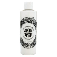 Mountain Ocean Skin Trip: botella de loción con coco para hidratación ligera y rápida.