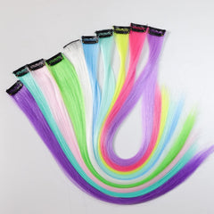 Ms Aloe glow-in-the-dark clip-in extensions shown on head for bold rainbow look