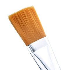 Close-up of Mudder brush head with silver bristles and yellow accent for even distribution.