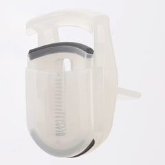 MUJI portable eyelash curler shown with compact packaging.
