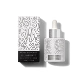 Naked & Thriving Illuminate BC+ serum bottle glowing with hydration for mature skin
