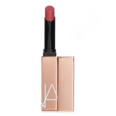 NARS Afterglow Sensual Shine Lipstick Dolce Vita swatch shows dusty rose color and luminous finish.